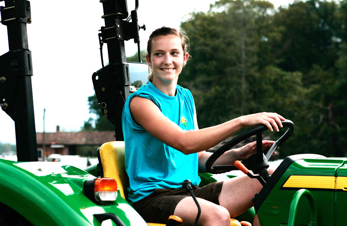 Girl driving a tractor